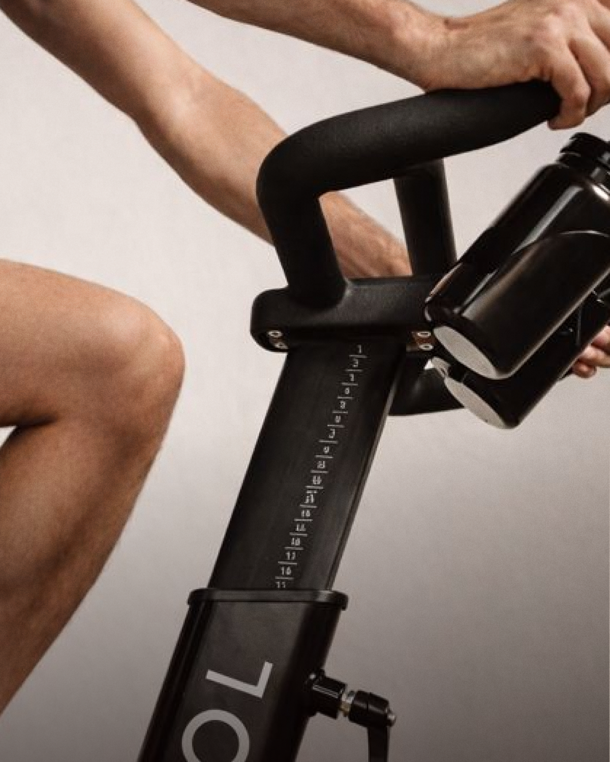 A knee and the CAROL Bike frame in close-up
