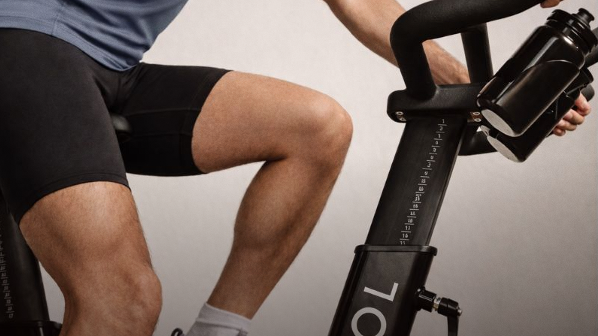 A rider on a CAROL Bike, legs and handlebars in frame